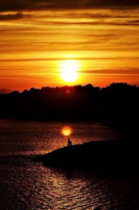 Scenic view of sunset over river