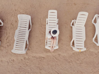 High angle view of white shoes on sand