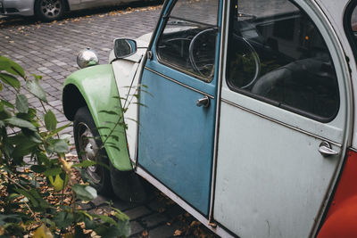 Close-up of vintage car on road