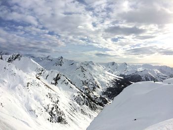 Scenic view of snowcapped mountains against sky