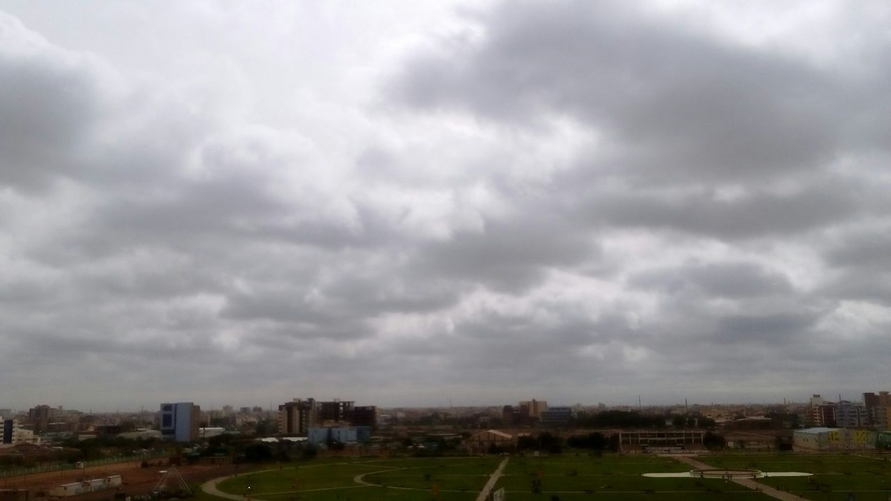 architecture, building exterior, built structure, city, sky, cloud - sky, cityscape, no people, weather, outdoors, skyscraper, day, storm cloud, residential building, modern, urban skyline, nature