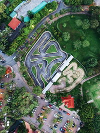 High angle view of road amidst trees in city