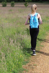 Girl standing on grassy field