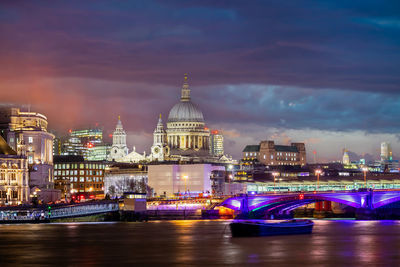 Illuminated buildings in city at night