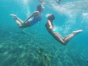 People swimming in sea