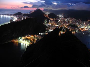 Aerial view of city lit up at night