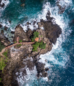 High angle view of rocks in sea. bird of eye view 4k