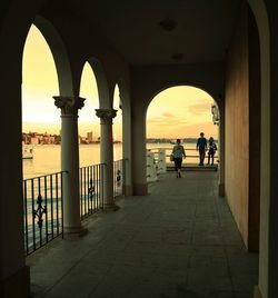 Tourists in front of columns