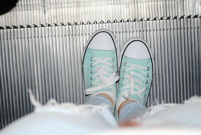 Low section of man wearing shoes