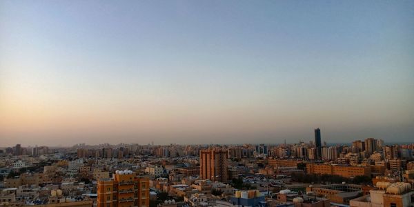 High angle view of buildings against sky during sunset