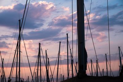 Silhouette boats against sky during sunset