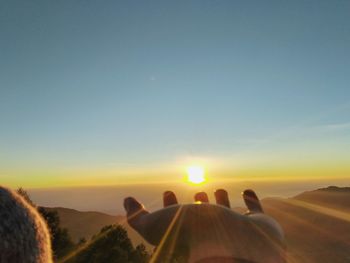 Scenic view of landscape against clear sky during sunset