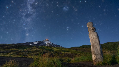 Scenic view of mountains against sky at night