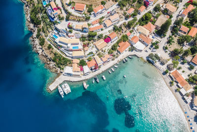 Assos picturesque fishing village from above, kefalonia, greece. aerial drone view. 