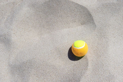 High angle view of yellow ball on floor