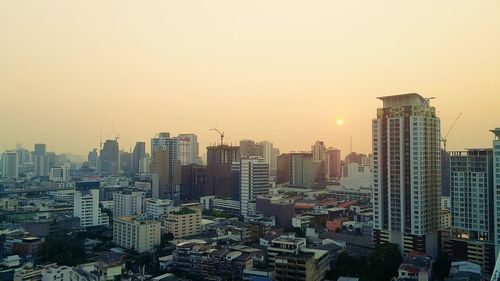 Cityscape against sky during sunset