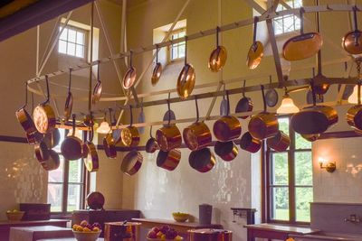 Low angle view of illuminated pendant lights hanging at home