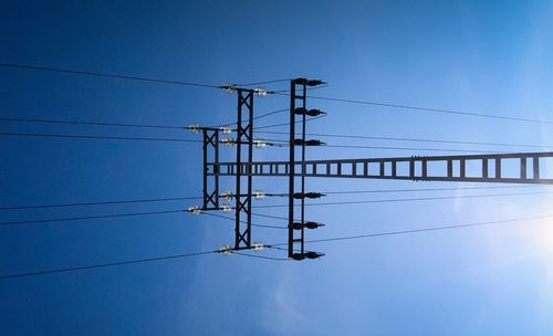 Low angle view of electricity pylon