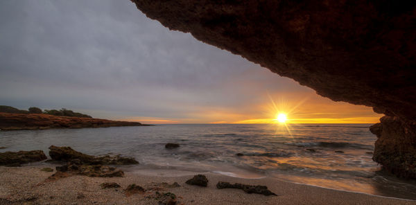 Scenic view of sea against sky during sunset