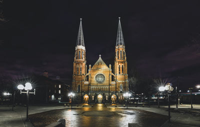 Vintage church glows bright with light on a winter night