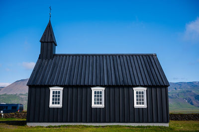 House on field against sky