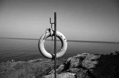 Rope on beach against clear sky