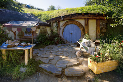 Table and chairs in yard against building