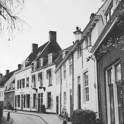 Buildings in city against clear sky