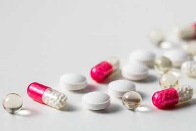 Close-up of pills on white background