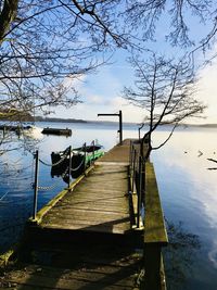Pier over lake against sky