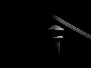 High angle view of wooden table against black background