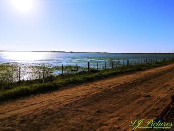 Scenic view of beach against clear sky