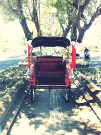 Empty red car on street in city