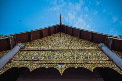 Low angle view of building against blue sky