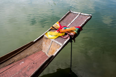 Colorful satin fabric tie at the prow of boat is worship