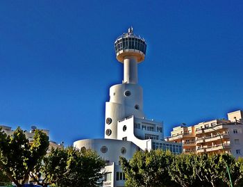 Low angle view of tower against blue sky