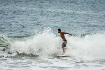 Man surfing in sea