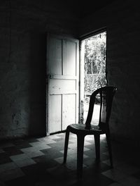 Empty chair in abandoned room