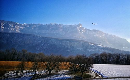 Scenic view of snowcapped mountains against sky