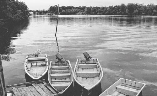 High angle view of boats moored in lake against sky