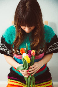 Close-up of woman holding flowers