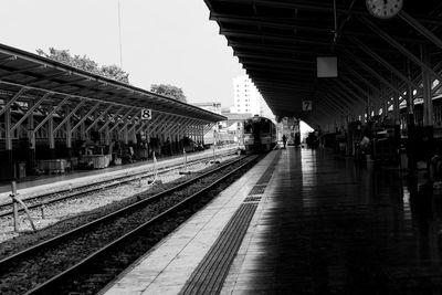 People waiting at railroad station platform