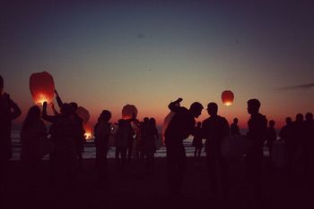 SILHOUETTE PEOPLE STANDING AT NIGHT