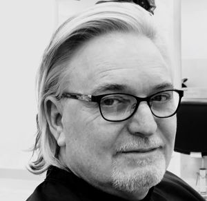 Close-up portrait of mature man wearing eyeglasses