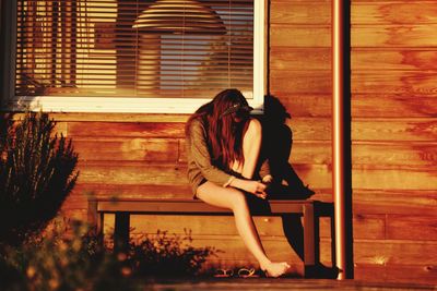 Young woman sitting indoors