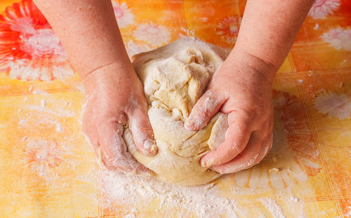 Low section of person preparing food