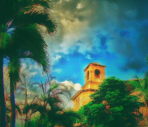 Low angle view of church against cloudy sky