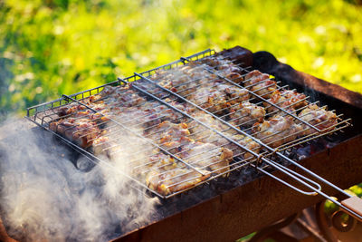 High angle view of meat on barbecue grill