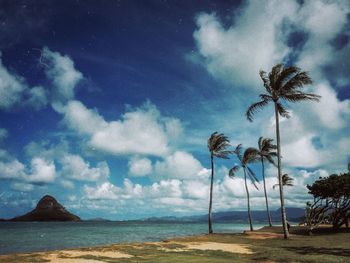 Scenic view of sea against cloudy sky