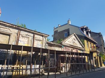 Low angle view of old building against blue sky